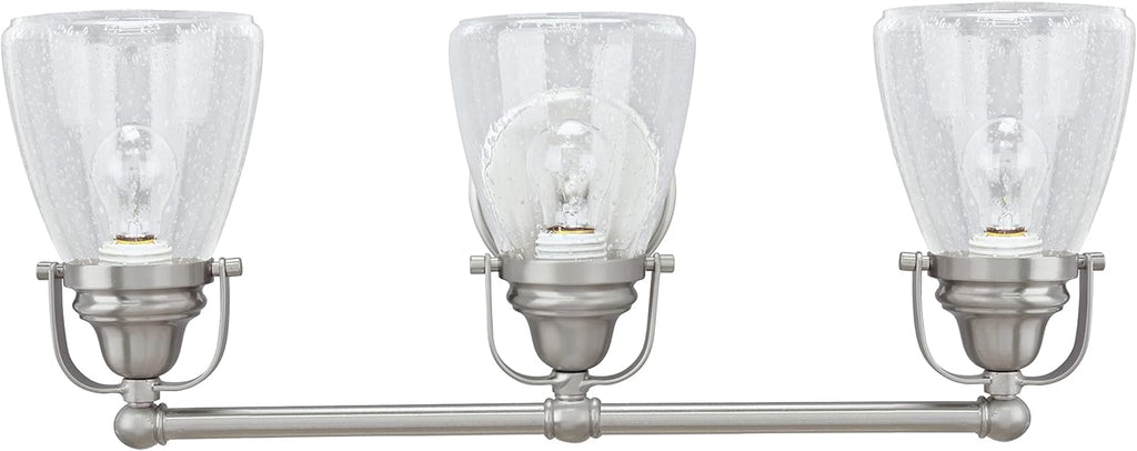 Aspen Creative 62099, Three-Light Metal Bathroom Vanity Wall Light Fixture, 24 1/2' Wide, Transitional Design in Brushed Nickel with Clear Seedy Glass Shade