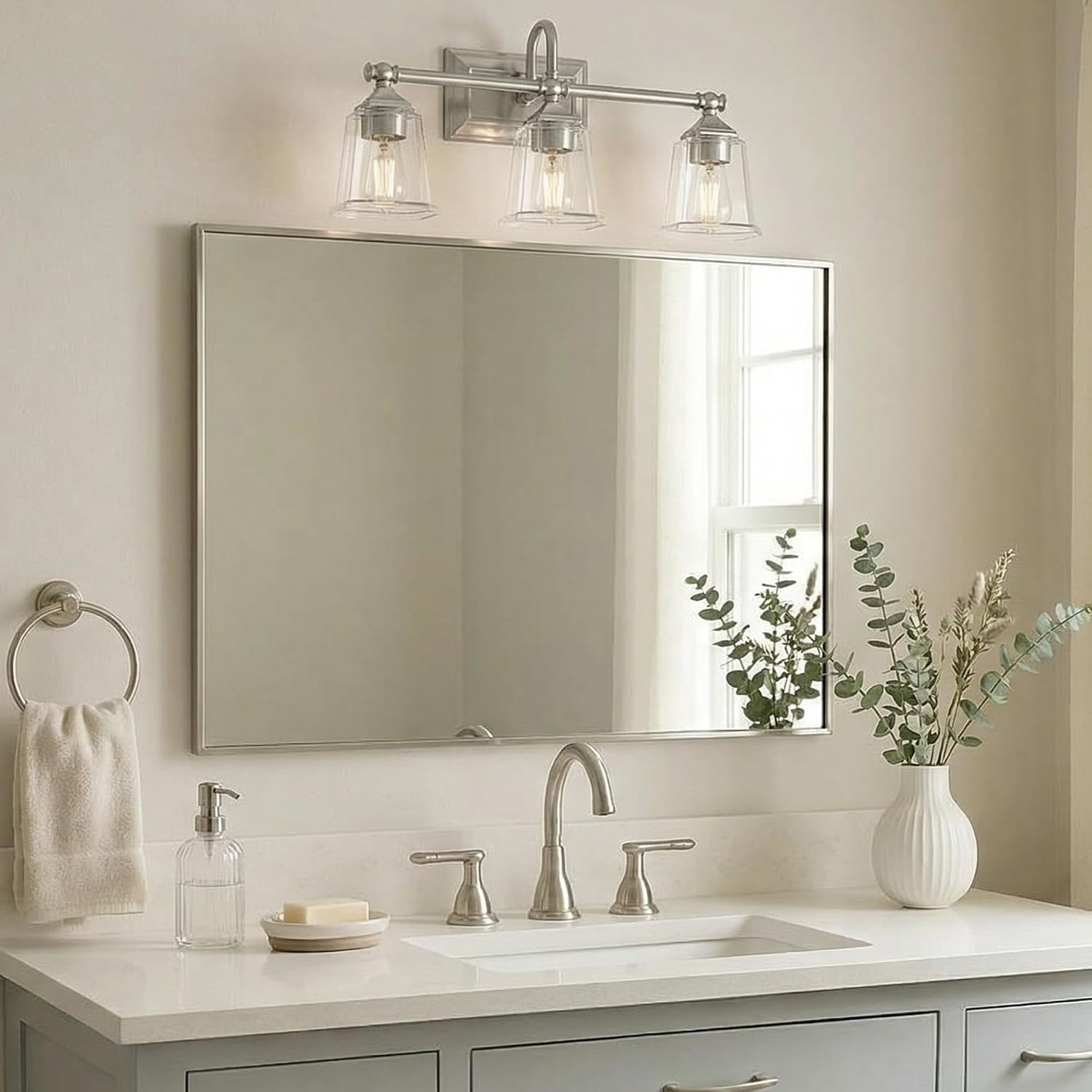 Quoizel Nicholas Vanity Lights, 22 Inch 3-Light Brushed Nickel Bathroom Lighting Fixtures Over Mirror, 100W, Clear Glass, Mid-Century Wall Mount Light for Bathrooms, Kitchen or Hallway