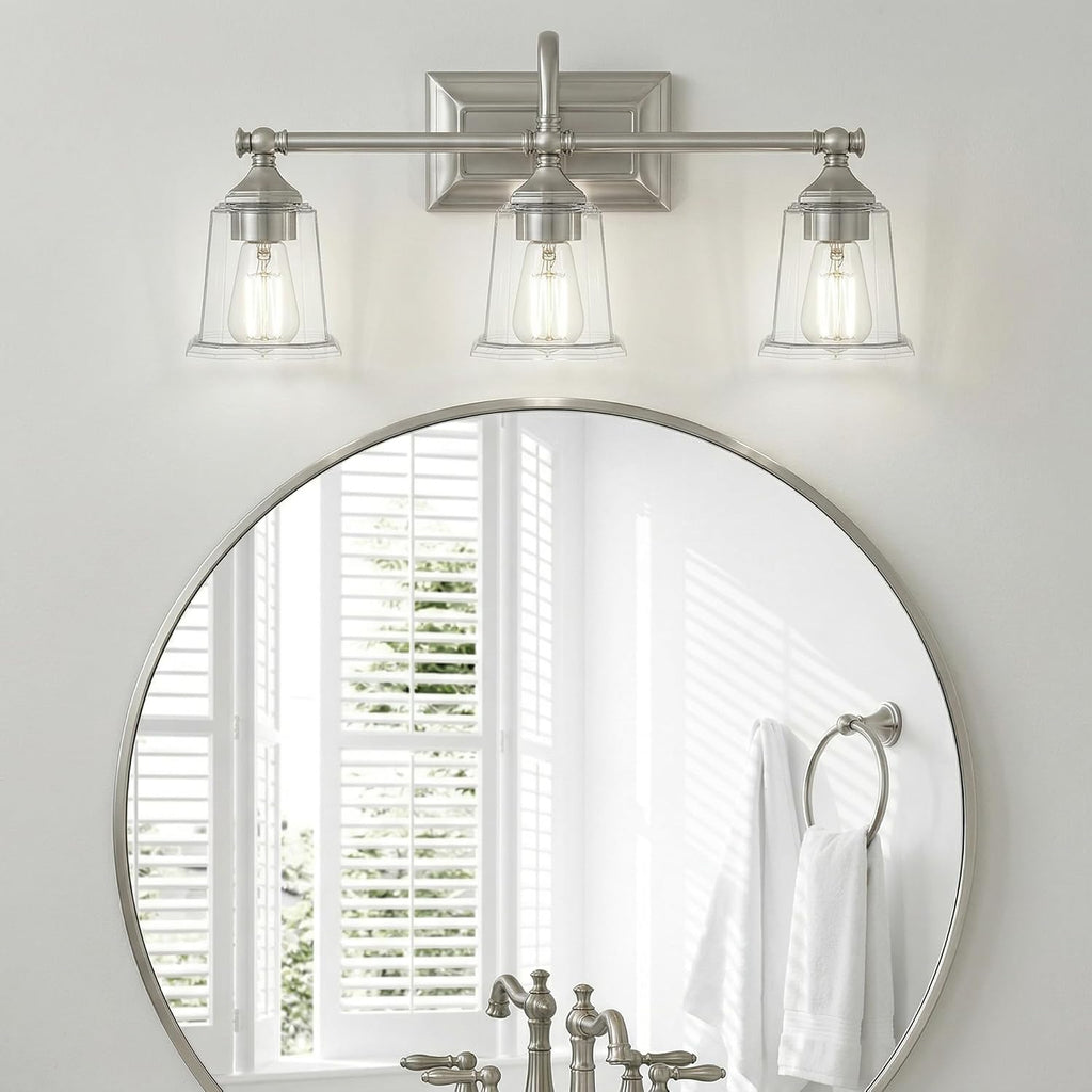 Quoizel Nicholas Vanity Lights, 22 Inch 3-Light Brushed Nickel Bathroom Lighting Fixtures Over Mirror, 100W, Clear Glass, Mid-Century Wall Mount Light for Bathrooms, Kitchen or Hallway