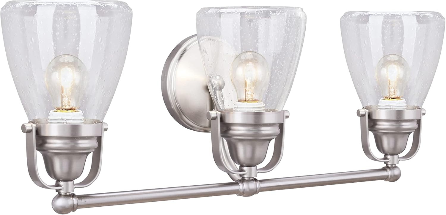 Aspen Creative 62099, Three-Light Metal Bathroom Vanity Wall Light Fixture, 24 1/2' Wide, Transitional Design in Brushed Nickel with Clear Seedy Glass Shade