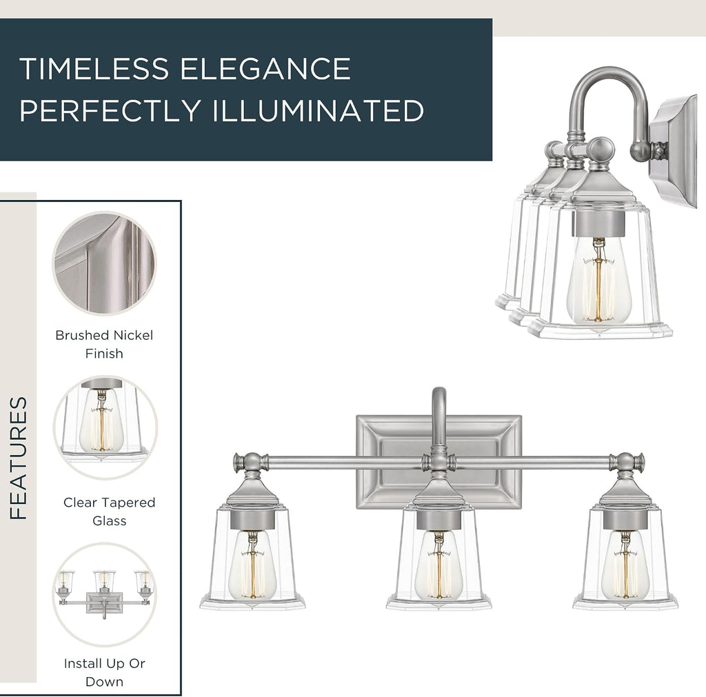 Quoizel Nicholas Vanity Lights, 22 Inch 3-Light Brushed Nickel Bathroom Lighting Fixtures Over Mirror, 100W, Clear Glass, Mid-Century Wall Mount Light for Bathrooms, Kitchen or Hallway