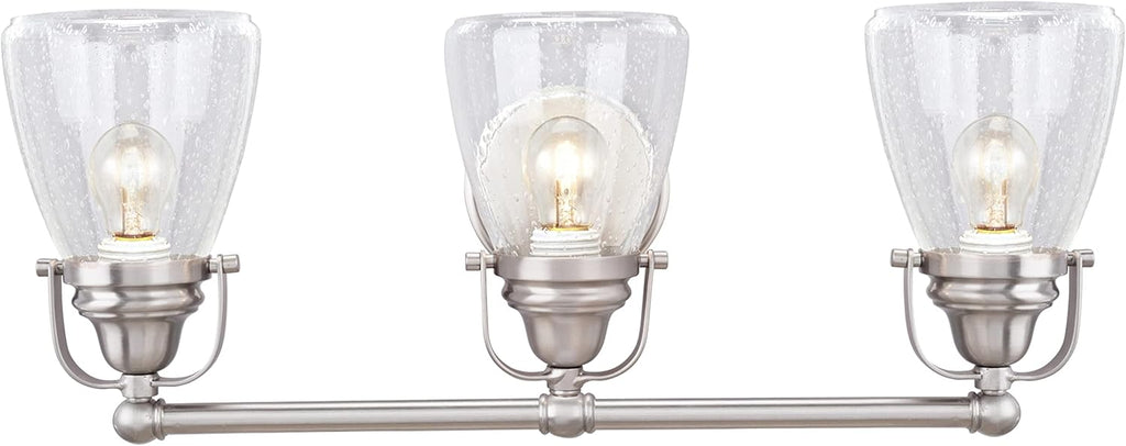 Aspen Creative 62099, Three-Light Metal Bathroom Vanity Wall Light Fixture, 24 1/2' Wide, Transitional Design in Brushed Nickel with Clear Seedy Glass Shade