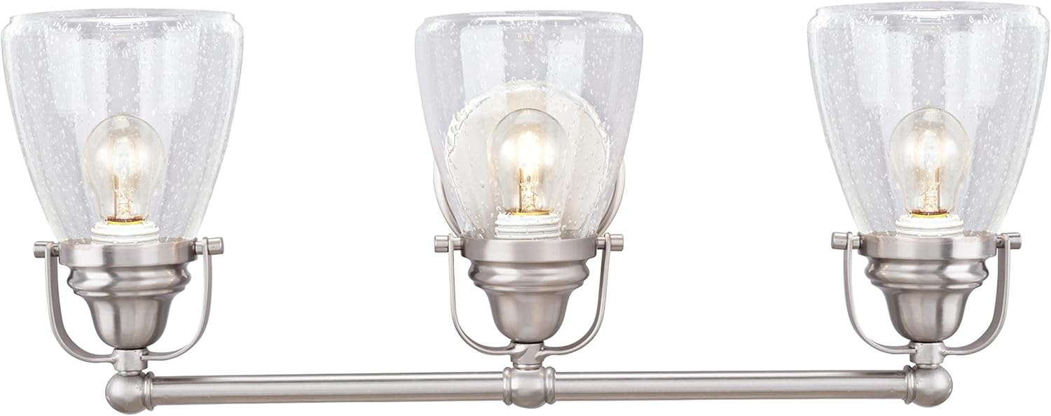 Aspen Creative 62099, Three-Light Metal Bathroom Vanity Wall Light Fixture, 24 1/2' Wide, Transitional Design in Brushed Nickel with Clear Seedy Glass Shade